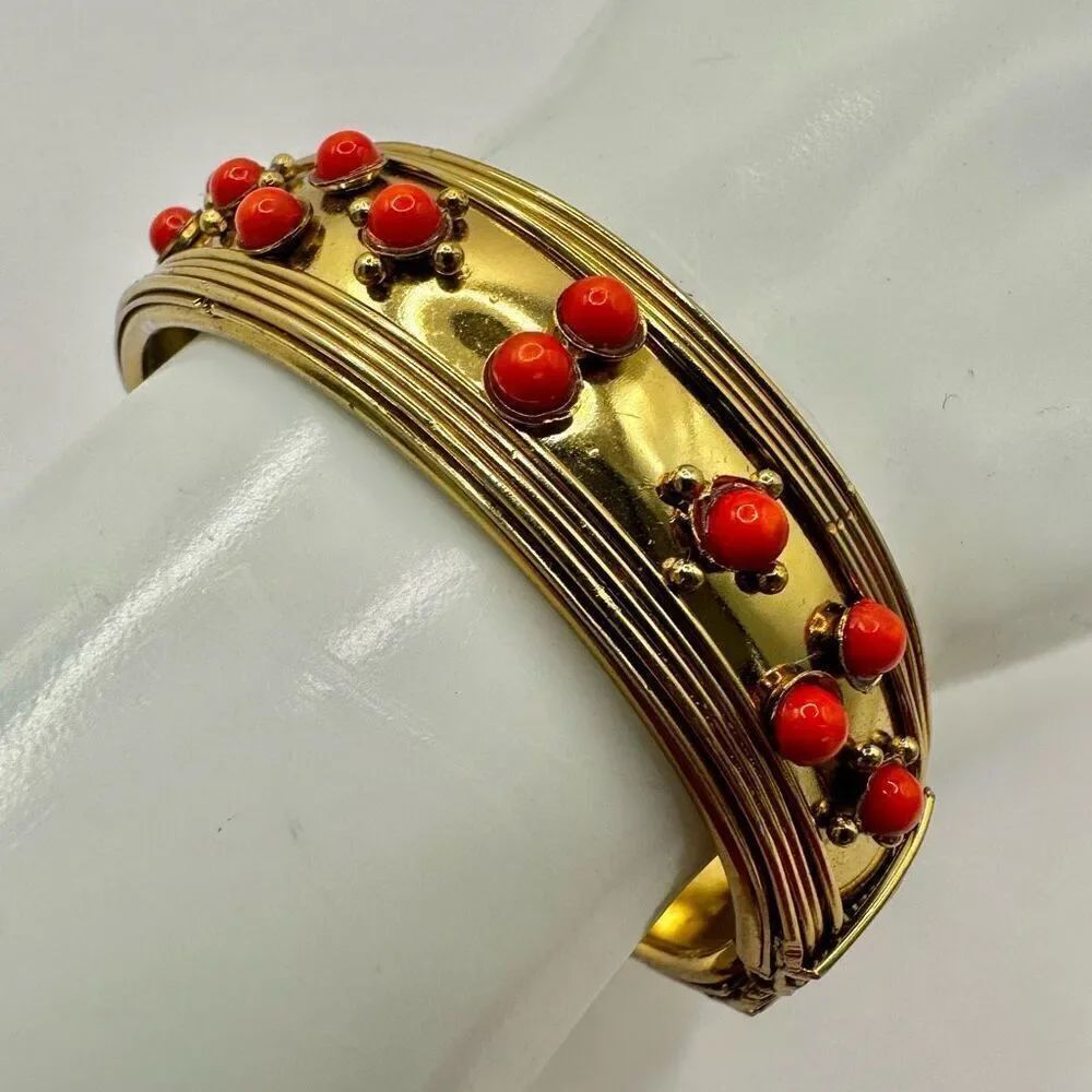 Gold tone and orange beaded hinged  bracelet